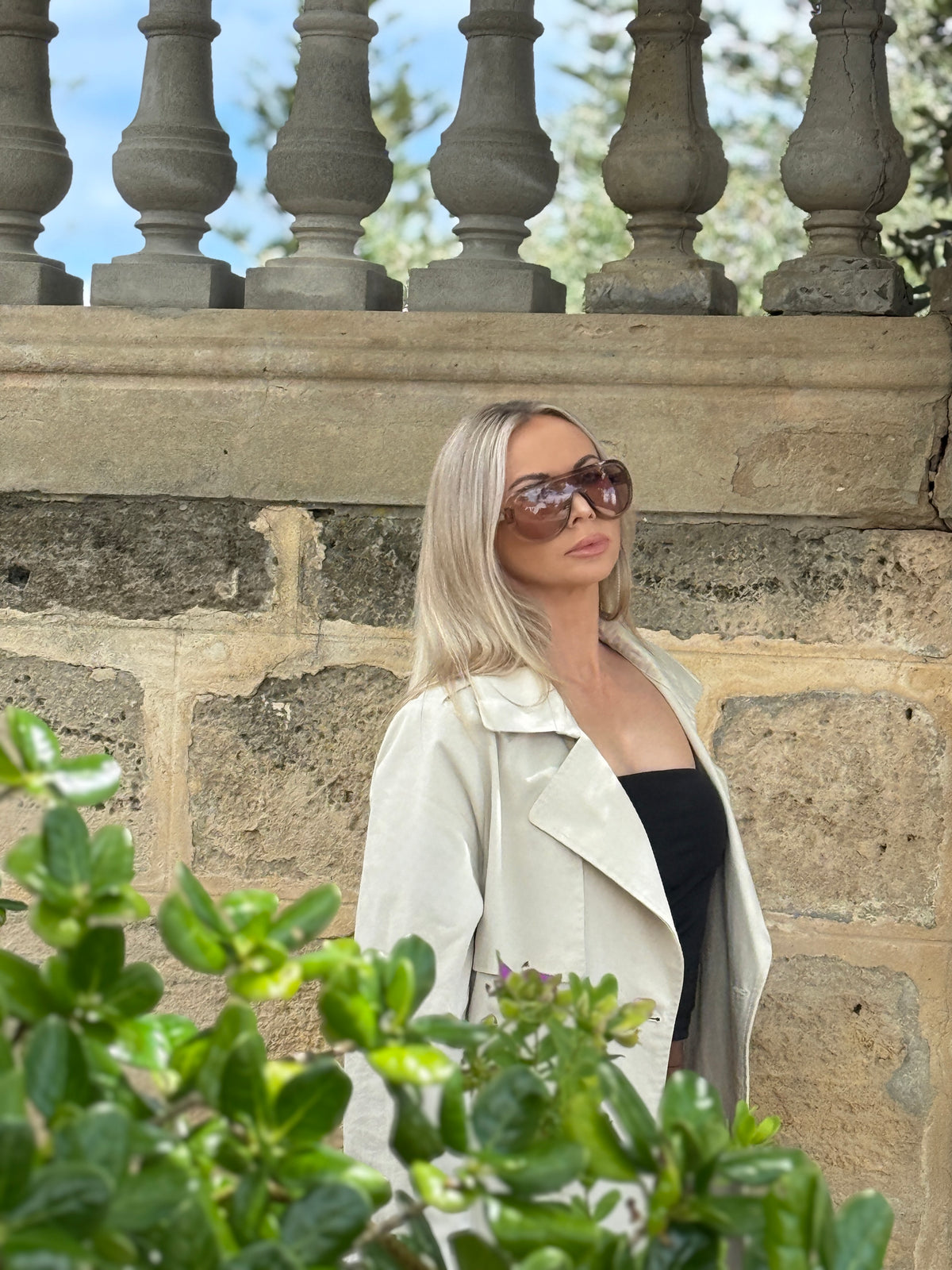 Close-up of the Amélie trench coat in stone showing the collar and lapels