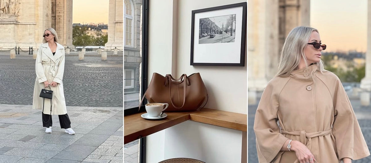 Parisian collection: the Amélie trench coat in stone beside a stone arch, a brown tote bag next to a cup of coffee, and the Éloise cape coat